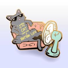 a pin with a cat sitting on top of a box that says i work so my cat can live better life