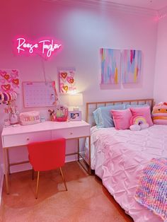 a room with a bed, desk and pink lights on the wall above it is a bedroom decorated in pastel colors