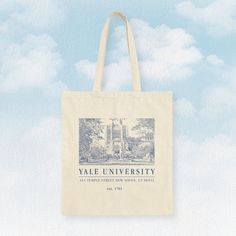 "Elevate your college style with our 100% cotton tote bag! 🎓👜 Embrace the campus vibes with a charming college design that's perfect for any occasion. 🏫💫Carry your books, laptop, and essentials in style and represent your college pride effortlessly. - 15\" x 16\" - 100% cotton canvas" Casual Cotton Canvas Bag For Back To School, Casual Campus Bags For Back To School, Casual Back To School Campus Bag, Casual Back-to-school Campus Bag, Trendy Cotton Canvas Bag For Back To School, Back To School Cotton Canvas Tote Bag, Rectangular Cotton Canvas Bag For Back To School, Back To School Cotton Tote Bag, Cotton Bags For Daily Use And Back To School