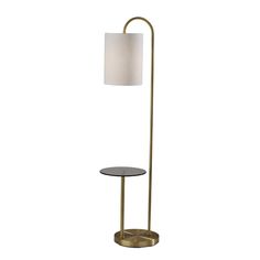 a floor lamp with a white shade on it