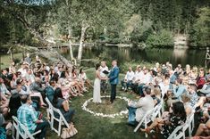 a couple getting married in front of an outdoor ceremony