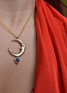 In the Ancient mythology Zirna was an Etruscan goddess of the waxing moon. The moon is the symbol of the soul, the closet celestial body of the planet Earth. This is a sculptural pendant, carved in wax, casted in Bronze, set with a beautiful Lapis Lazuli gemstone & polished to a beautiful burnished gold finish. It is harmonized with a long bronze cable chain. Circumference is 42 cm. Looks great layered on it's own but do not hesitate to pair it with other chain necklaces for a truly unique look Symbolic Moonstone Jewelry With Moon Charm, Mystical Sun And Moon Pendant Necklace, Symbolic Moonstone Jewelry With Moon Phase Detail, Spiritual Moon Jewelry With Sun And Moon Design, Mystical Sun And Moon Design Pendant Necklace, Symbolic Moon Charm Pendant Jewelry, Symbolic Half Moon Jewelry With Moon Charm, Celestial Style Necklace With Moon Charm, Celestial Moon-shaped Jewelry For Meditation