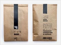 two brown paper bags with black handles and numbers on them, one has a barcode