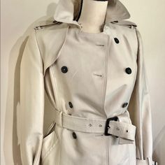 Beige Zara Trench Coat, Fully Lined With Removable Belt. Unworn. Measurements: Across Chest: 13 Inch Across Shoulders: 15 Inch Arm Length: 24.5 Inch Base Of Throat To Hem: 28 1/2 Inch Belt Length: 43 Inch (Last Hole Length: 32 Inch) Fitted Luxury Zara Outerwear, Zara Luxury Fitted Outerwear, Luxury Fitted Zara Outerwear, Fitted Neutral Zara Outerwear, Zara Luxury Spring Outerwear, Luxury Zara Outerwear For Spring, Luxury Cream Outerwear For Spring, Luxury Beige Outerwear For Spring, Luxury Spring Outerwear By Zara