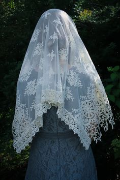 "Evintage Veils~ In an incredibly intricate, beautiful embroidered lace, this soft, ivory veil is of heirloom quality. A medium length mantilla, it provides excellent coverage, and it is soft and comfortable. Measures about 50 X 23 inches. In a long size, here: https://www.etsy.com/listing/1056055539/evintage-veils-mater-dei-heirloom-wrap?ref=shop_home_active_1 Also in an infinity veil here: https://www.etsy.com/listing/960466585/evintage-veilsready-to-ship-mater-dei?ref=shop_home_active_41& Cream Bohemian Lace With Lace Trim, Bohemian Cream Lace With Lace Trim, Bohemian Cream Crochet Lace, Traditional Crochet Lace For Wedding, Vintage Embroidered Lace For Wedding, Vintage Lace With Lace Trim For Ceremony, Cream Lace Veil With Lace Work, Bohemian Lace Patchwork For Wedding, Bohemian Scalloped Lace In Cream