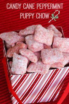 a red and white striped box filled with sugar cubes on top of a table