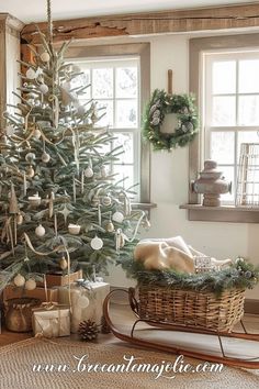 a decorated christmas tree in a living room next to a window with wreaths on the windowsill