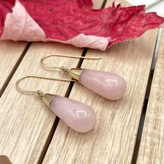 Rose Quartz dangle gold earrings, Gemstone teardrop earrings, Beaded stone statement earrings Long dangle teardrop earrings featuring gorgeous Rose Quartz teardrops made with 14 K gold filled ear wires or lever back.           The Rose Quartz teardrop is about 1.18" ( 30 mm ) long and the largest part of the teardrop is about 0.4" ( 10 mm ) wide. These earrings can be made with 14 K gold filled ear wires or lever backs ( as shown in the pictures ) and the earrings full length is about 1.6" ( 40 Elegant Teardrop Earrings With Natural Stones, Rose Gold Rose Quartz Drop Earrings, Pink Gemstone Teardrop Earrings, Elegant Rose Quartz Drop Earrings, Rose Gold Teardrop Crystal Earrings, Rose Quartz Drop Earrings For Jewelry Making, Pink Teardrop Earrings With Natural Stones, Rose Quartz Teardrop Earrings For Gift, Elegant Teardrop Rose Quartz Earrings