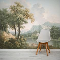 a wall with a painting on it and a white chair in front of the wall