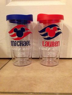 two mickey mouse tumblers sitting next to each other