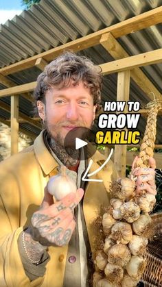 a man is holding up some onions in his hand and pointing to it with the words how to grow garlic