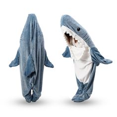 two people in shark costumes standing next to each other