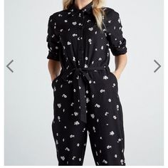 Get Into An Easy One-And-Done Outfit With This Long-Length Jumpsuit Designed With Feminine Details Including Floral Print And A Tie To Cinch The Waist. Button Down Long Sleeves Collar Fabric & Care 100% Cotton Black Relaxed Fit Jumpsuits And Rompers For Spring, Black Relaxed Fit Jumpsuit For Workwear, Black Jumpsuits And Rompers For Spring Workwear, Chic Jumpsuits And Rompers With Pockets For Daywear, Black Overall Jumpsuit For Spring, Black Spring Overalls Jumpsuits And Rompers, Spring Daywear Jumpsuits And Rompers In Overall Style, Elegant Floral Print Jumpsuits And Rompers With Short Sleeves, Elegant Floral Print Jumpsuit With Short Sleeves