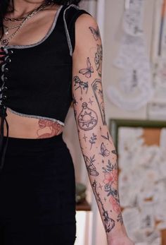 a woman with many tattoos on her arm