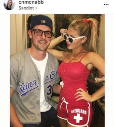 a man and woman dressed up in baseball uniforms