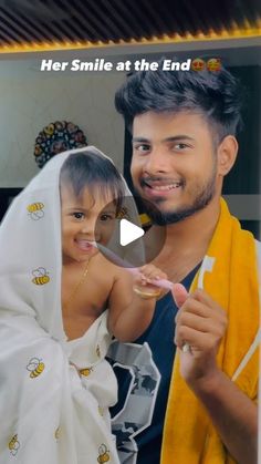 a man and woman are smiling at the camera while brushing their teeth with a toothbrush