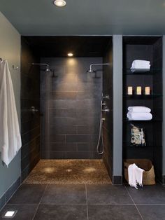 a walk in shower sitting inside of a bathroom