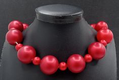 Vintage Deep Red Chunky Beaded Choker Necklace 1960's. Measures 18 1/2 inches long. In very good vintage condition. A nice addition to any collection. PS3 Red Costume Jewelry Necklaces For Party, Party Large Beads Round Beaded Necklaces, Red Round Bead Necklaces For Party, Red Beaded Necklaces For Parties, Costume Jewelry Necklaces With Polished Beads For Party, Party Costume Jewelry Beaded Necklace With Large Beads, Party Costume Jewelry With Large Beaded Necklace, Party Costume Jewelry With Large Beads Necklace, Party-style Costume Jewelry With Large Beads