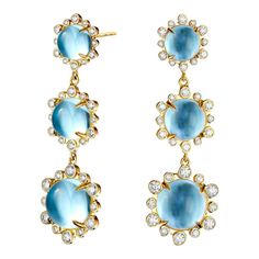 Created in 18 karat yellow gold Blue Topaz 17 carats approx. Diamonds 1 carat approx. Post backs for pierced ears Limited Edition  Crafted from 18-karat yellow gold, these earrings boast a majestic blue topaz weighing approximately 17 carats, and are accented with diamonds totaling approximately one carat. For pierced ears, these limited-edition earrings feature post backs.  About the Designers    Drawing inspiration from little things, Dharmesh & Namrata Kothari have created an extraordinary and refreshing collection of luxurious jewels. True believers of destiny, they always feel that the possibilities of design - and life - are limitless when people work together. Formed in 2003, Syna Jewels has grown through enduring relationships with well known, established companies and have evolved Blue Diamond-accented 14k Gold Earrings, Blue Diamond Accent Earrings In 14k Gold, Blue Diamond Accent 14k Gold Earrings, Yellow Gold Earrings With Blue Topaz Gemstone, Luxury Blue Topaz Earrings With Prong Setting, Blue Diamond Pierced Earrings, Yellow Gold Blue Topaz Earrings, Anniversary Yellow Gold Blue Topaz Earrings, Anniversary Yellow Gold Earrings With Blue Topaz