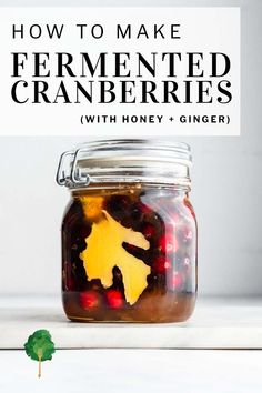 a jar filled with pickled cranberries and the words how to make fermented cranberries