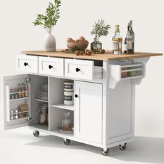 a white kitchen island with lots of bottles on it and food in the bottom drawer