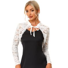 This lace cardigan is designed with a long sleeve, a unique scalloped hem with a lace trim, and a cropped shrug. The shrug top features a stand collar and an open front design that can make you wear it on and down. The elegant bolero shrug is perfect for dress-up to complete the charming look. Great for spring/fall, casual daily, cocktail, evening parties, wedding parties, work, dating, and coffee shops. Spring Party Shrug With Lace Trim, Fitted Lace Cardigan For Party, Spring Fitted Shrug With Lace Trim, Fitted Shrug With Lace Sleeves For Spring, Fitted Party Shrug With Lace Trim, Fitted Lace Trim Shrug For Party, Fitted Lace Trim Party Shrug, Fitted Lace Shrug With Lace Trim, Long Sleeve Lace Cardigan With Lace Patchwork