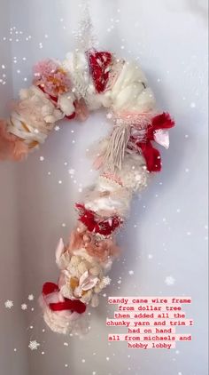 a christmas wreath made out of fabric and flowers