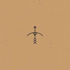 an arrow is drawn on the side of a brown wall with black dots in it