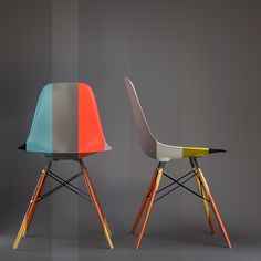 two colorful chairs sitting side by side next to each other