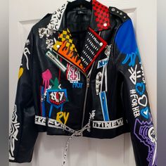 Nwot For Her Nyc "She's Dope" Graffiti Faux Leather Jacket Size: Xl Measurements: Shoulder 17" Bust 40" Sleeve 25" Length 20" Spiky Leather Jacket, Spring Black Biker Jacket With Graphic Print, Multicolor Leather Outerwear For Fall, Black Leather Jacket With Graphic Print For Fall, Edgy Fitted Multicolor Outerwear, Biker Style Graphic Print Outerwear For Fall, Biker Leather Jacket With Graphic Print For Winter, Trendy Black Biker Jacket With Graphic Print, Biker Style Outerwear With Graphic Print For Fall