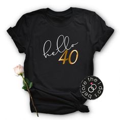 a black t - shirt with the words hello 30 printed on it next to a pink rose