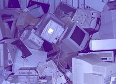 a pile of old computers sitting on top of each other