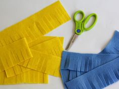 scissors and strips of felt next to each other