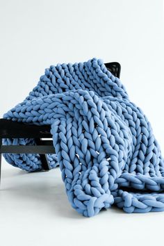 a chair that is covered in a blanket