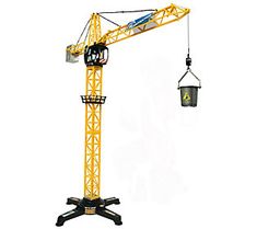 a yellow tower crane with a bucket hanging from it's side and a light on top