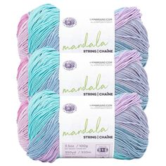 three skeins of yarn in blue, pink and white colors with the words nandal