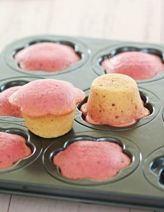 cupcakes with pink frosting in a muffin tin