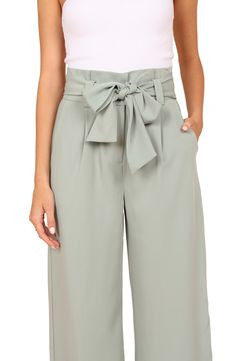 Wide legs punctuate these tailored pants designed with a drapey tie belt and crisp pleats. Zip fly with hook-and-bar closure Front slant pockets Removable tie belt Lined 100% polyester Hand wash, dry flat Imported Elegant Belted Bottoms With Paperbag Waist, Elegant Belted Paperbag Waist Bottoms, Chic Tie Waist Ankle-length Pants, Chic High-waisted Tie Waist Pants, Chic High-waisted Pants With Tie Waist, Chic Ankle-length Tie Waist Pants, Spring Dress Pants With Belt Loops For Work, Chic Tie Waist Bottoms For Workwear, Spring Workwear Dress Pants With Belt Loops