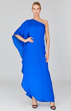 a woman in a blue one shoulder dress