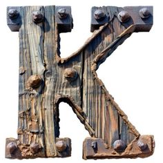 the letter k is made out of wood and has metal rivets on it