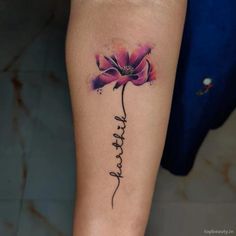 a woman's leg with a tattoo that says thank on it and a pink flower