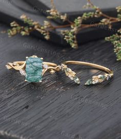 a close up of a ring on top of a wooden table with flowers in the background