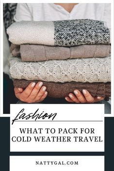 a woman holding several sweaters with the words fashion what to pack for cold weather travel