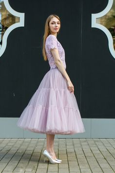 Feminine Tiered Tulle Skirt Dress, Feminine Pleated Tulle Skirt, Feminine Fitted Tulle Skirt, Feminine Flared Dress With Tulle Skirt, Feminine Tulle Flared Dress, Feminine Flared Tulle Dress, Tulle Dress With Ruffled Flared Skirt, Feminine Full Tulle Skirt Dress, Spring Tiered Tulle Tutu Dress