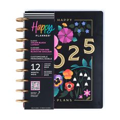 the happy planner is printed with flowers and numbers on black paper, which reads'happy planner 525 '