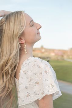 These dangles are the PERFECT earring for a special occasion. These posts are made with 18k gold plated stainless steel and the flowers are made with 18k gold plated brass, so they are a perfect option for girlies with sensitive ears. They are also SUPER lightweight so they are comfortable to wear ALL DAY! This is such a classy and gorgeous option, you NEED these. This dangle measures to 2.5 inches in length. Feminine Spring Dangle Earrings, Spring Feminine Dangle Jewelry, Feminine Spring Dangle Jewelry, Feminine Jewelry With Matching Earrings For Spring, Feminine Hypoallergenic Dangle Earrings, Feminine Drop Earrings For Spring, Feminine Dangle Flower Earrings, Dainty Flower Earrings For Spring Wedding, Feminine Spring Flower Dangle Earrings