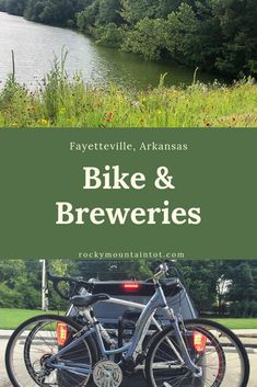 two bikes parked next to each other in front of a lake