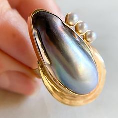 Vintage Baroque Pearl Cocktail Ring 14K Yellow Gold Baroque Pearl 30.2x13.9mm 7.9gm Size 7 sizing available with fee contact us to have it added to the price before checkout. Thank you for visiting our shop! 𝑫𝑴𝑲 𝑱𝒆𝒘𝒆𝒍𝒓𝒚 Unique Gold Oval Pearl Ring, Pearl Cocktail Ring, Pearl Vintage, Gold Baroque, Vintage Ring, Baroque Pearls, Cocktail Ring, Cocktail Rings, Vintage Rings