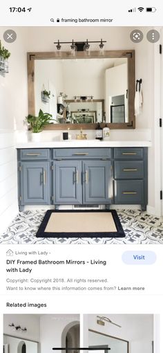 the bathroom is decorated in blue and white with gold accents on the vanity, mirror, and rug