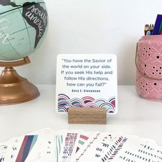 a desk with some cards and a globe on it